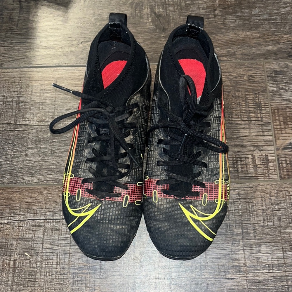 Kids mercurial soccer cleats. Black neon yellow, and red